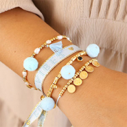 Sets d'inspiration Comment incorporer les pendentifs pompons dans les bijoux?